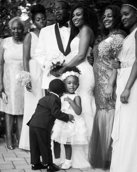 Black Wedding Moment Of The Day: When The Ring Bearer Steals A Hug From the Flower Girl and the Spotlight
